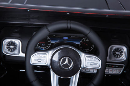 Officially Licensed Mercedes Benz AMG G63 Kids Ride-On Car, Black- white. leather seat- rubber wheels